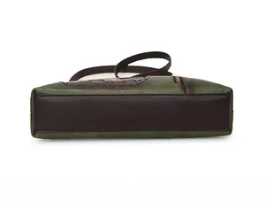 Detailed bottom view of retro green and brown crossbody bag with premium leather texture