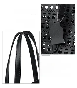 Detail of black laser-cut hollow pattern and cat charm on a structured leather handbag