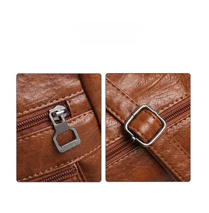 Détail du cuir grainé marron montrant la fermeture éclair métallique et la boucle de réglage