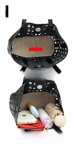 Macro view of black laser-cut tote bag interior with large capacity for daily items