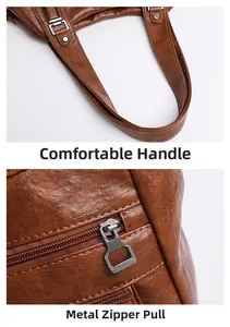 Gros plan du sac en cuir marron avec poignées renforcées et fermeture éclair en métal