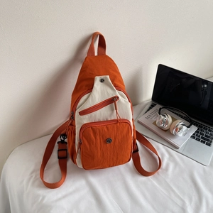 Sac bandoulière en nylon orange et beige avec sangle pour trajet quotidien