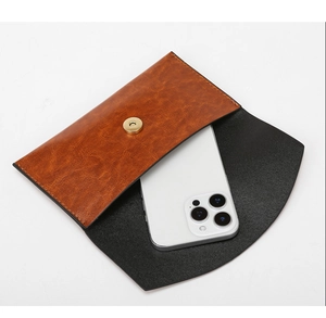 Internal view of brown litchi pattern flap phone bag showing its large storage capacity