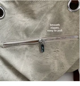 Detail of high-quality smooth metal zipper and canvas texture on large tote bag