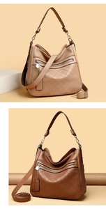 Detail of quilted leather bags in khaki and brown with double zip pockets and chains