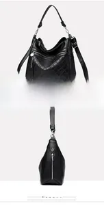 Detail view showing black leather tote texture with diamond quilted pattern and zippers