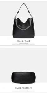 Detail view of the black textured leather bag showing the back zipper and sturdy wide bottom