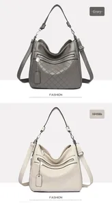 Detail of multi-layered soft leather crossbody bag with rhombic stitching and zipper pockets