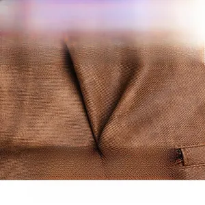 Close-up of soft brown faux leather texture showing water-resistant finish and fine grain