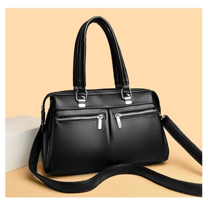 Close-up of litchi texture leather handbags with dual zippers and silver hardware