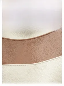 Detail of color-block textured leather with durable stitching and water-resistant finish