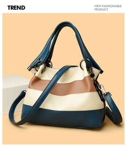 Macro shot of tricolor wavy leather bag detail with lychee texture and metal rings