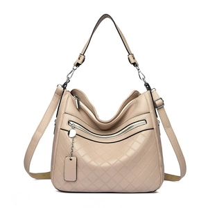 Beige multi-layer faux leather handbag with diamond stitching and adjustable strap