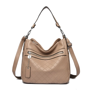 Khaki quilted soft leather crossbody bag with multiple zippers and adjustable strap