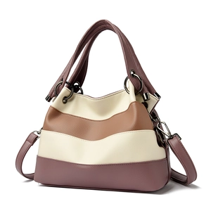 Fashion color block leather tote bag with purple and cream panels and top handles