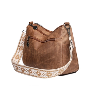 Brown soft PU leather shoulder bag with multi-zipper layers and ethnic embroidery strap