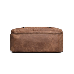 Bottom view of retro brown soft leather shoulder bag with metallic stud details