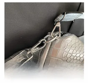 Close-up of silver crocodile embossed bag with high-quality metal hardware hooks