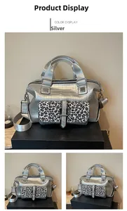 Silver crocodile embossed bag detail featuring a bold leopard print front pocket