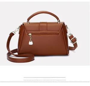Detailed back view of brown leather handbag featuring a secure gold zipper pocket