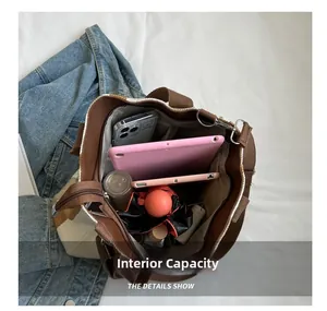 Internal capacity of the striped tote bag showing space for tablet and daily items