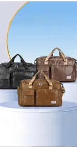 Close-up of PU leather travel bag showing organized compartments and dual front pockets