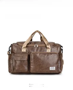 Front view of large brown leather sports travel bag with shoulder strap and multiple pockets