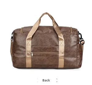 Detail view of the brown leather travel bag reverse with zipper pocket and handles