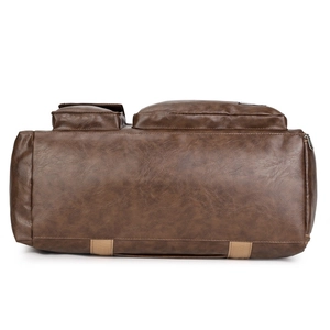 Large capacity dark brown travel duffel bag with leather texture and top zipper detail