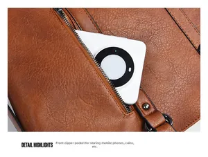 Detail der vorderen Reißverschlusstasche für Handy und Münzen an der braunen Ledertasche