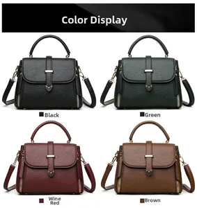 Sacs à main en cuir grainé noir, vert, bordeaux et marron pour femmes en détail