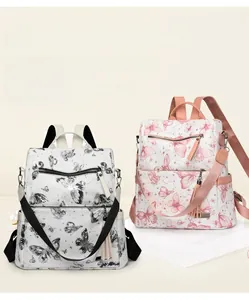 Close-up of butterfly print backpack showing spacious pockets and tassel detail