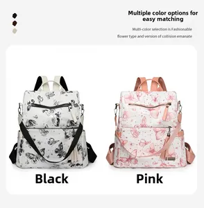 Detail of black and pink butterfly print backpacks with decorative tassel zipper pulls