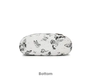Detailed bottom view of a white backpack with butterfly print and constellation patterns