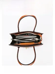 Internal view of large brown leather tote bag with multi-layer storage and compartments