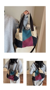 Detail view of multi-color canvas tote bag showing hand-held and cross-body styling