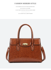 Detailed view of caramel brown retro tote bag with golden twist lock and twin handles