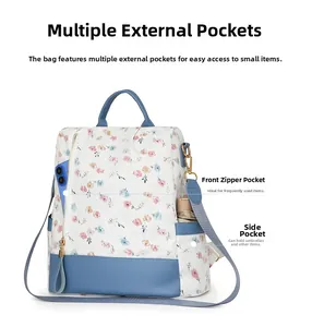 Detail view of large capacity floral backpack featuring side umbrella pocket and front phone slot