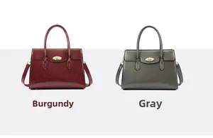 Detail view of burgundy and grey handbags with golden twist locks and long shoulder straps