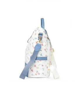 Detail view of floral leather backpack with side pocket and blue adjustable strap