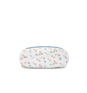 Close-up of floral print backpack detail with blue zipper and pastel fabric texture