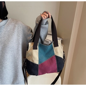 Detail view of multi-color patchwork canvas tote bag with adjustable shoulder strap