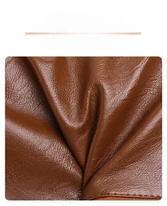 Close-up of brown litchi pattern leather showing soft texture and fine grain detail