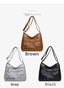 Three woven faux leather crossbody bags in brown, grey, and black with multiple zip pockets