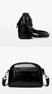 Detalle frontal y trasero de bolso negro brillante de cuero PU con cremalleras múltiples