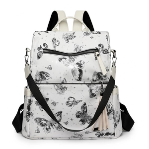 White butterfly print backpack for women with tassels and large capacity for travel