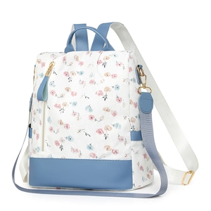 Floral print women backpack with navy leather bottom and gold zipper accents