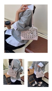 Detail of pink plaid bucket bag showing pearl charms, lace bows and heart pendants