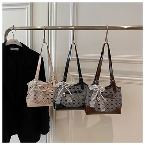 Detailed set of three retro bucket bags featuring bow prints and lace trim accents