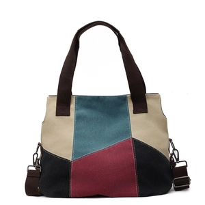 Contrast color canvas tote bag with multi-color geometric patchwork and crossbody strap